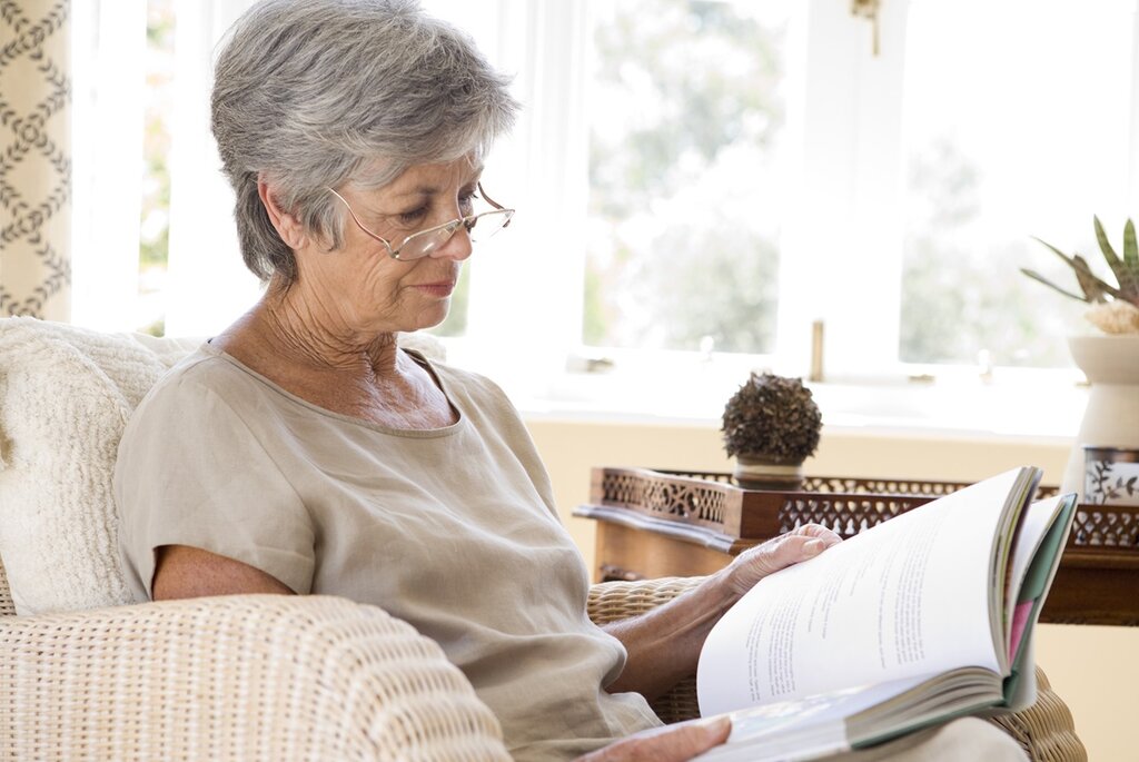 Older person reading a book